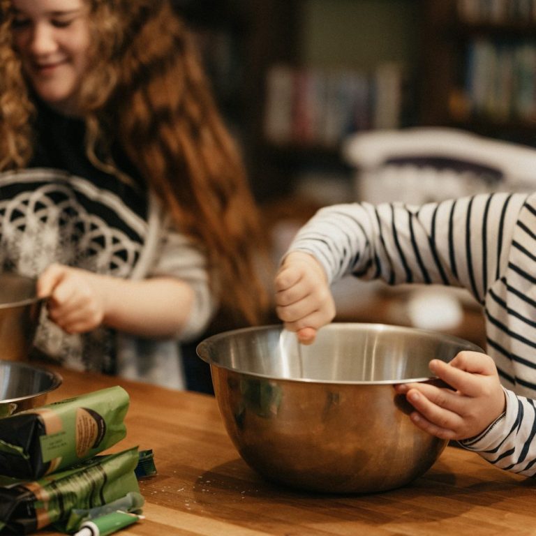 Culinary Creation Children mixing ingredients in the kitchen.